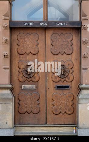 Wooden doors, Lloyds Bank, Market Street, Wellingborough, Northamptonshire, England, UK Stock Photo