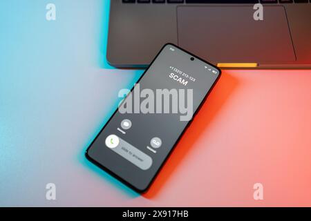 Scam call concept on mobile phone. Person get scam call alert. Phone call from unknown number late at night. Scam, fraud or phishing with smartphone Stock Photo