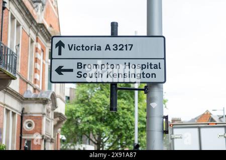 LONDON- MAY 23, 2024: Road traffic sign in SW1 for London Victoria, Brompton Hospital and South Kensington Stock Photo