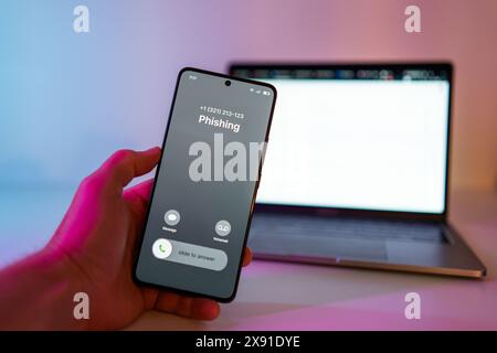 Phishing call concept on mobile phone. Person get phish call alert. Phone call from unknown number late at night. Scam, fraud or phishing with Stock Photo