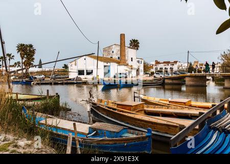 El Palmar, Spain - March 24, 2024: Traditional wooden boats in the village of El Palmar in Natural Park Albufera Stock Photo