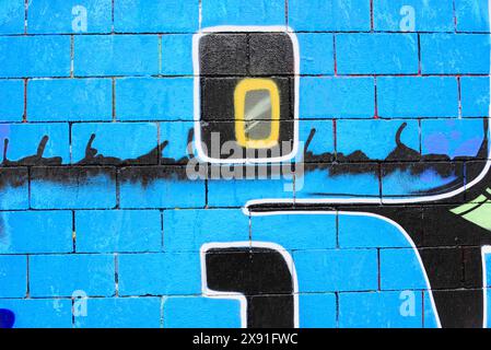 Barcelona, Catalonia, Spain, Europe, Plain graffiti on blue brick wall with number and bar motifs Stock Photo