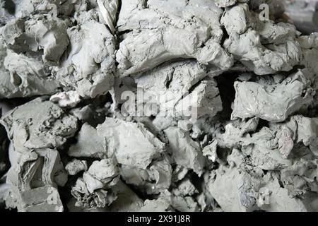 Large pile of   modeling clay . Clay for sculpture texture background . Close up view Stock Photo