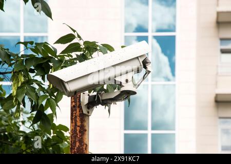 Surveillance of cctv camera installed on the metal pole closeup Stock Photo