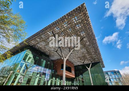 Netherlands, Amsterdam - April 10, 2024: Sustainable Headquarter building of Nationale Postcode Loterij, Dutch Charity Lotteries with modern roof Stock Photo