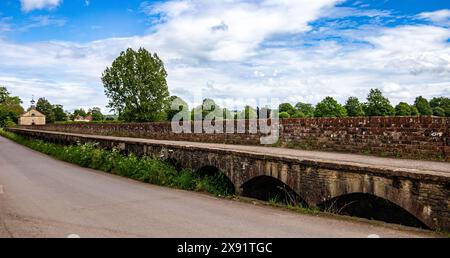 Old stone raised arched causeway to keep pedestrians dry when the river floods part of the Maud Heaths causeway Tytherton Kellaways Wiltshire Stock Photo