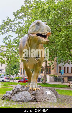 Frankfurt, Germany - May 21, 2024: sculpture of T-Rex, a big dinosaur, in front of the Senckenberg museum in Frankfurt, Germany. Stock Photo