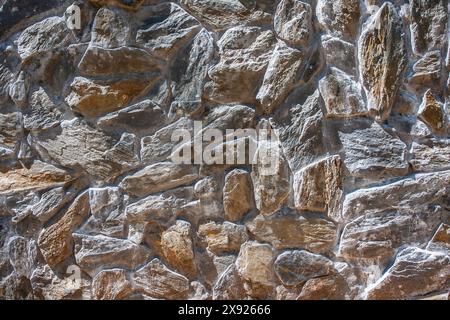 Stone background, a clearly visible stone structure, natural ecological building material and at the same time artistic abstraction Stock Photo