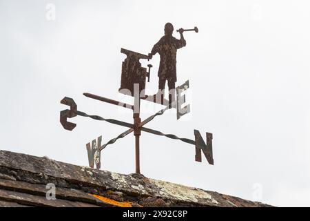 Weather vane with metal blacksmith sculpture Stock Photo