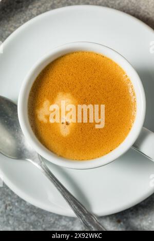 Warm Hot Dark Italian Espresso Coffee Shot in a Cup Stock Photo