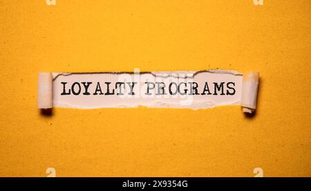 Loyalty program, text words typography written on paper against wooden background, life and business motivational inspirational concept Stock Photo