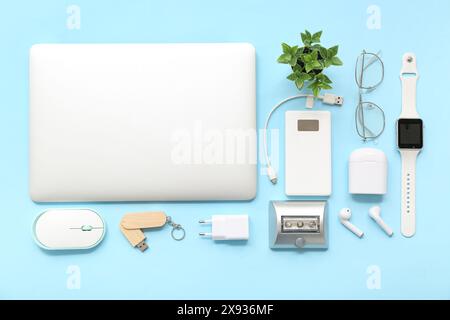 Composition with different modern gadgets on color background Stock Photo