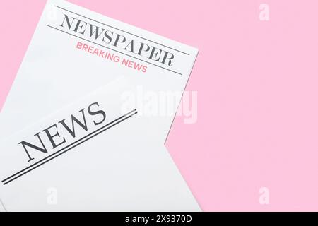 Blank newspapers on pink background Stock Photo