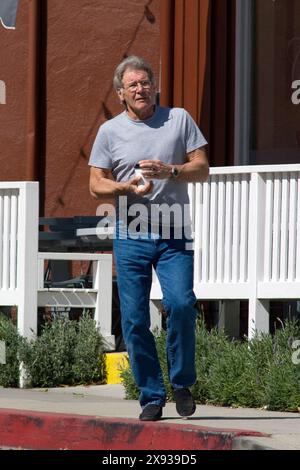 Harrison Ford stop in Brentwood to take a coffee,he is really good looking and in great shape.  In brentwood,Califonia on March 08, 2011 Stock Photo