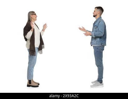Young man and senior woman talking on white background. Dialogue Stock Photo