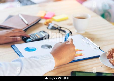 Excel stat spreadsheet business analytics graph statistic with graph and table data number in charts database. Accountant hands pointing excel stat fi Stock Photo