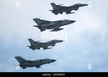 U.S. Air Force F-16 Fighting Falcon fighter aircraft and German and Italian Air Force Tornado fighter aircrafts fly in formation to celebrate the 50-y Stock Photo