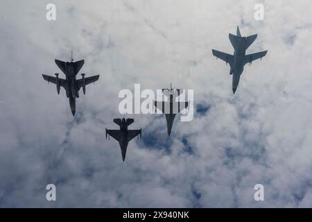 U.S. Air Force F-16 Fighting Falcon fighter aircraft and German and Italian Air Force Tornado fighter aircrafts fly in formation to celebrate the 50-y Stock Photo