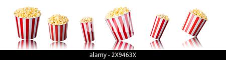 Set of paper striped bucket with popcorn isolated on white background, concept of watching TV or cinema. Stock Photo
