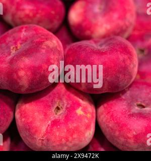 Closeup of raw ripe flat Peaches (Prunus persica var. platycarpa) Stock Photo