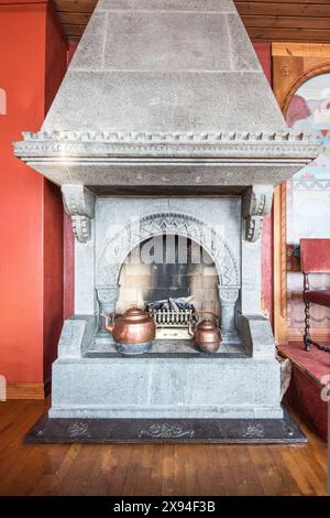 Two superb, old copper kettles on a magnificent fireplace at the Kvitnes Hotel In Balestrand, Norway. Stock Photo