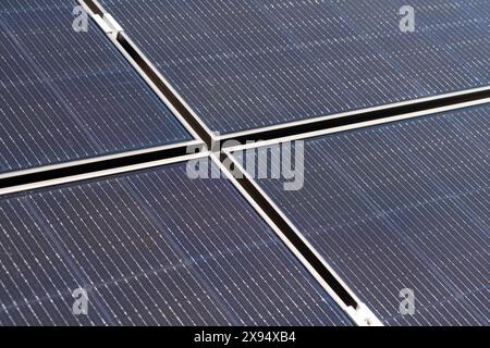 Close-up photo of the surface of solar panels in a solar power plant. Stock Photo