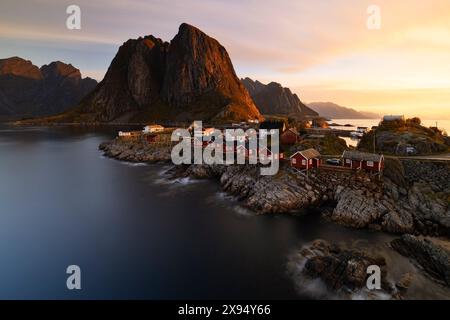 Long exposure to capture the warm light during an autumn sunrise in the fisherman village of Hamnoy, Lofoten Islands, Nordland, Norway, Scandinavia Stock Photo