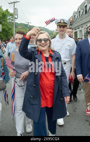 Hillary Clinton marching and waving an American flag at the 2024 Memorial Day Parade in Chappaqua, Westchester, New York Stock Photo