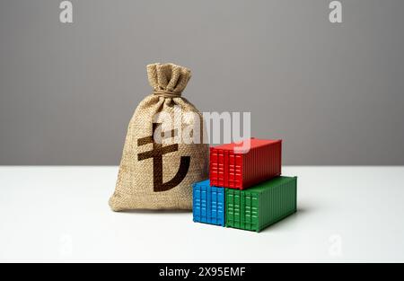 Stack of shipping containers and turkish lira money bag. Import or export. Production of containers. Trade, economics and transport industry. Tariffs Stock Photo