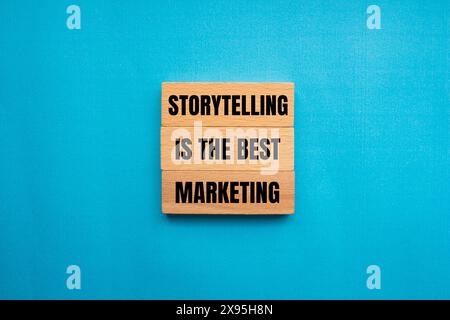 Storytelling is the best marketing words written on wooden blocks with blue background. Conceptual storytelling is the best marketing symbol. Copy spa Stock Photo