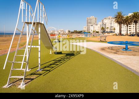 empty deserted play park or children's playground with equipment or apparatus in a coastal suburb in Cape Town, South Africa Stock Photo