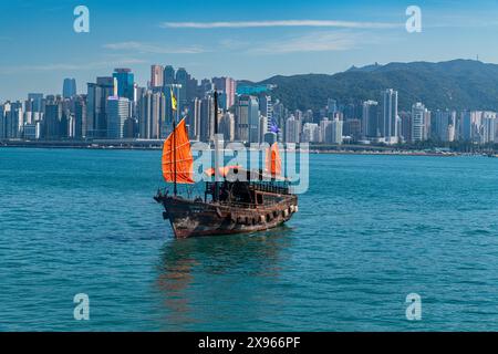 Traditional sailing boat in front of high rise buildings in Central Hongkong, China, Asia Stock Photo