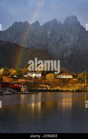 Mountains and rainbow from Ballstad harbour during sunrise, Vestvagoy, Nordland, Lofoten Islands, Norway, Europe Stock Photo