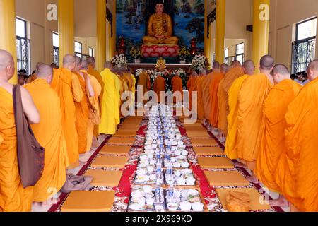 Vegetarian meal, Monks at Buddhist ceremony in the main hall, Phuoc Hue Buddhist pagoda, Vietnam, Indochina, Southeast Asia, Asia Stock Photo