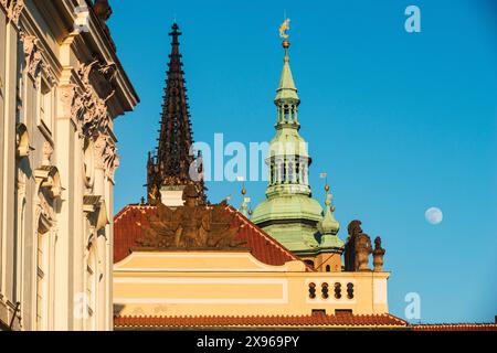 Roof decoration of Prague Castle, towers of St. Vitus Cathedral and moon, Hradcany Square, Hradcany,UNESCO World Heritage Site, Prague, Czechia, Europ Stock Photo