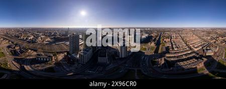 Super wide panoramic aerial view Dutch centre of Utrecht with high rise buildings of financial district infrastructure hub towering over the city Stock Photo