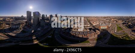 Super wide panoramic aerial view Dutch centre of Utrecht with high rise buildings of financial district infrastructure hub towering over the city Stock Photo