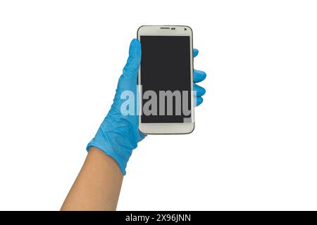 Gloved hand holding a smart phone on white background. Stock Photo