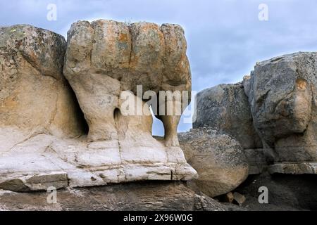 Rock formation showing wind erosion along the rocky coast of Boltodden in summer, Kvalvågen, Svalbard / Spitsbergen, Norway Stock Photo