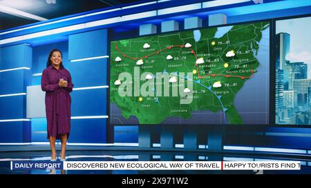 TV Weather Forecast Program: Professional Television Host Reviewing Weather Report in Newsroom Studio, Uses Big Screen with Visuals. Famous Anchorwoman Talks. Mock-up Cable Channel Concept. Stock Photo