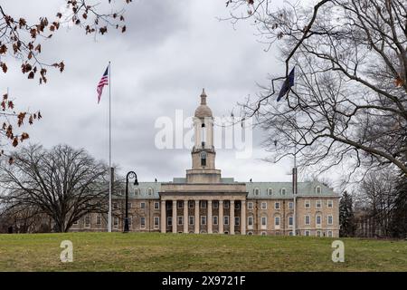 The Old Main building in winter time on the campus of Penn State University Stock Photo