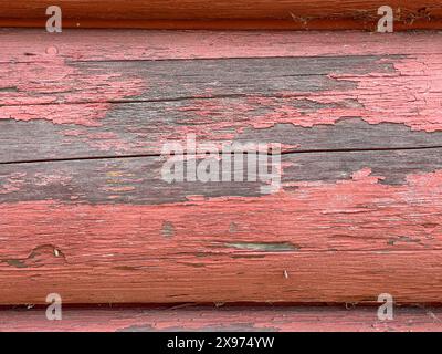 Background Image of Distressed Cabin Logs Painted Red and Weathered Perfect for a Slide Show Background Stock Photo