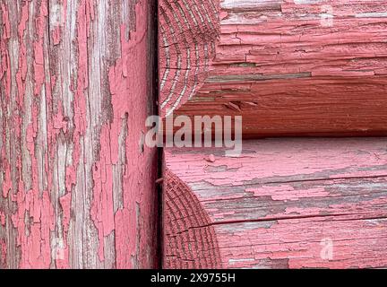 Background Image of Distressed Cabin Logs Painted Red and Weathered Perfect for a Slide Show Background Stock Photo