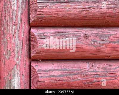 Background Image of Distressed Cabin Logs Painted Red and Weathered Perfect for a Slide Show Background Stock Photo