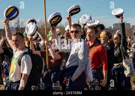 Swedish-speaking student holding their student caps in the air just ...