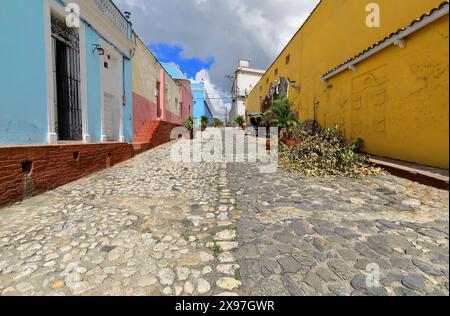 335 Cobbled Calle Padre Quintero Street going up to the Teatro Principal Theater and the transversal Calle Maximo Gomez Street. Sancti Spiritus-Cuba. Stock Photo