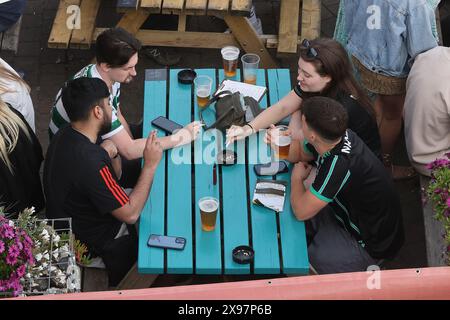 People drinking and smoking in a pub garden  in Brighton Stock Photo