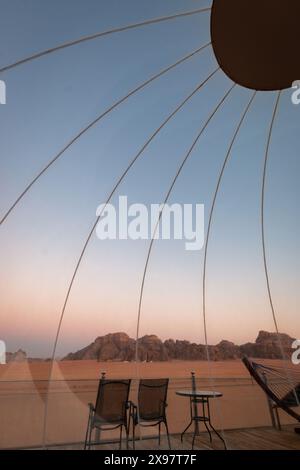 Sunrise at Wadi Rum desert seen trough the dome of a bubble tent Stock Photo