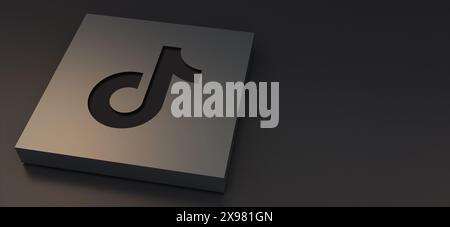 Auckland, New Zealand - April 29, 2021: Tiktok logotypes engraved on metal plate. 3d Illustration Luxurious background of social media icon. Stock Photo