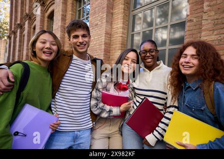 Portrait of a cheerful group of young multiracial student looking at the camera having fun Stock Photo